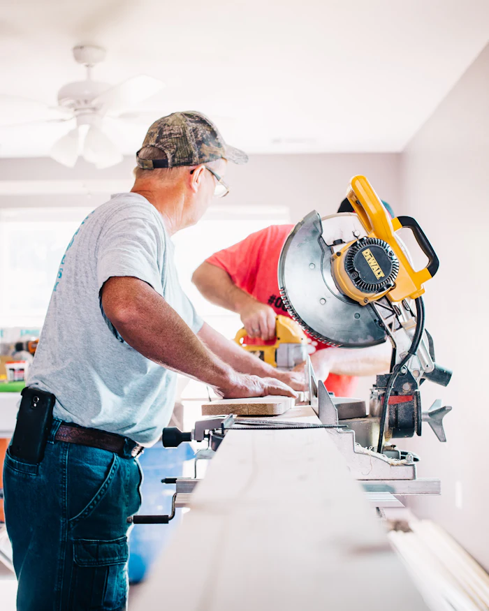 Contractor using a miter saw during an interior home renovation